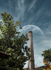 a brick chimney with a moon in the sky